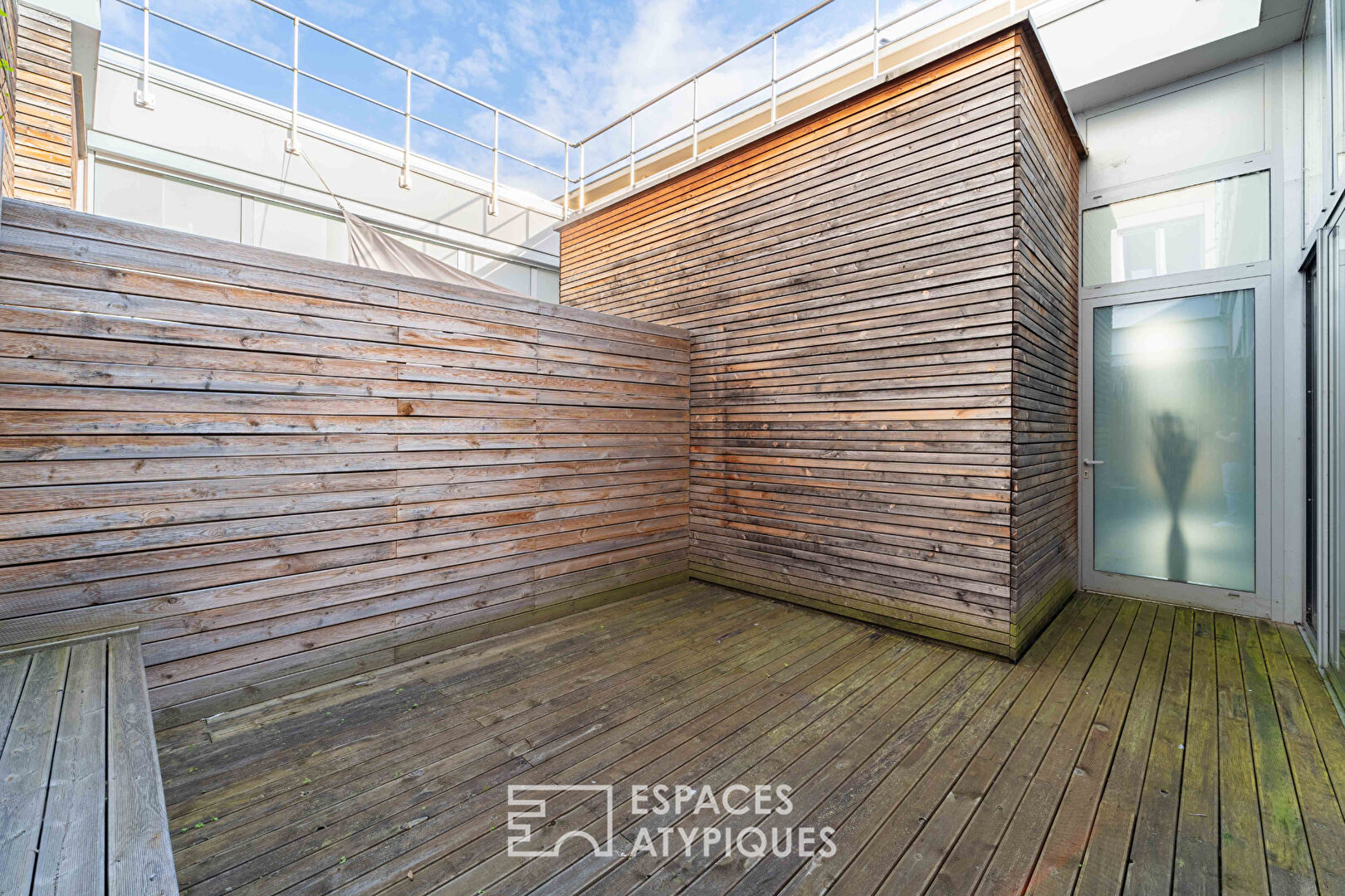 Loft et ses terrasses dans ancien supermarché
