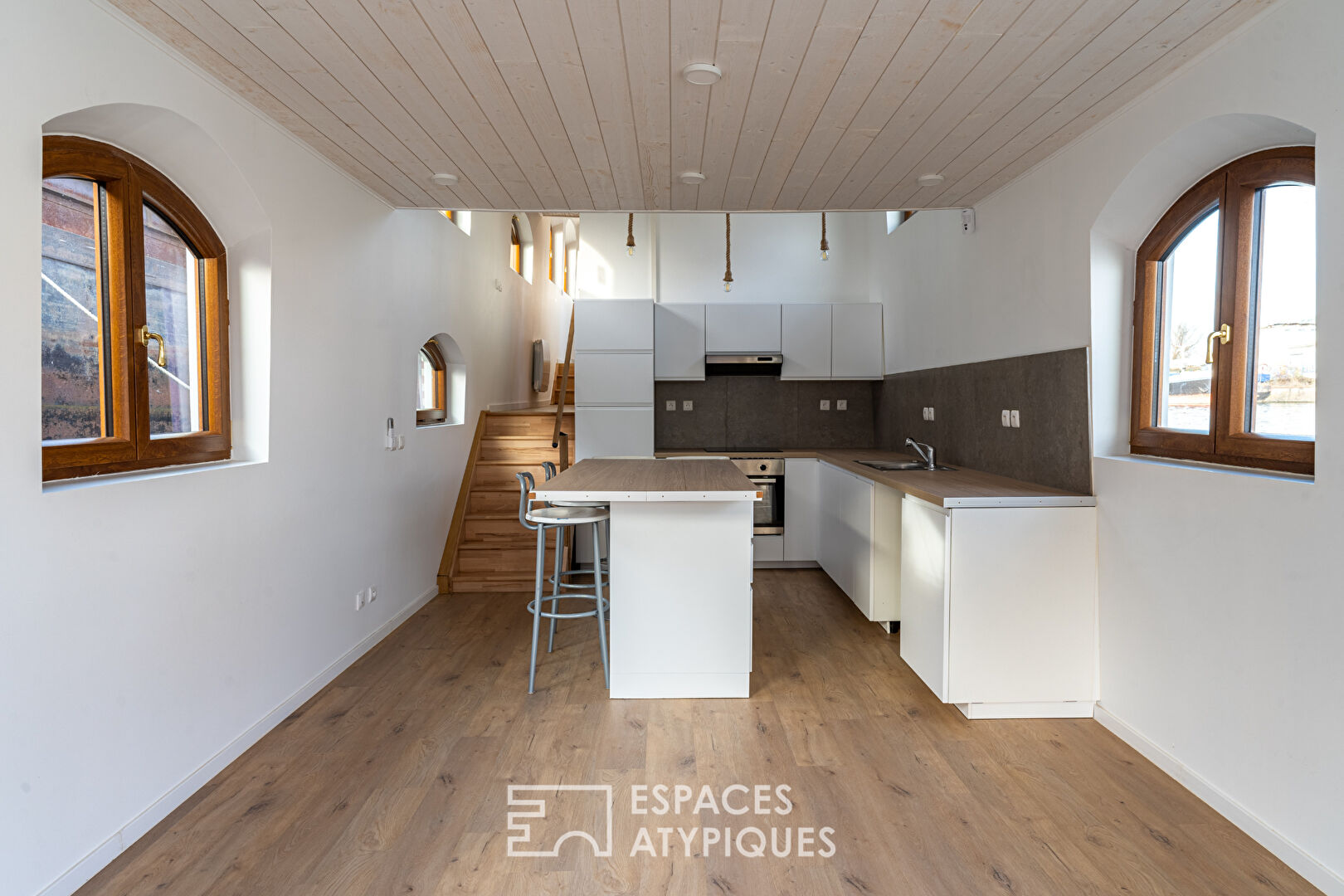 Renovated barge with two terraces on the water