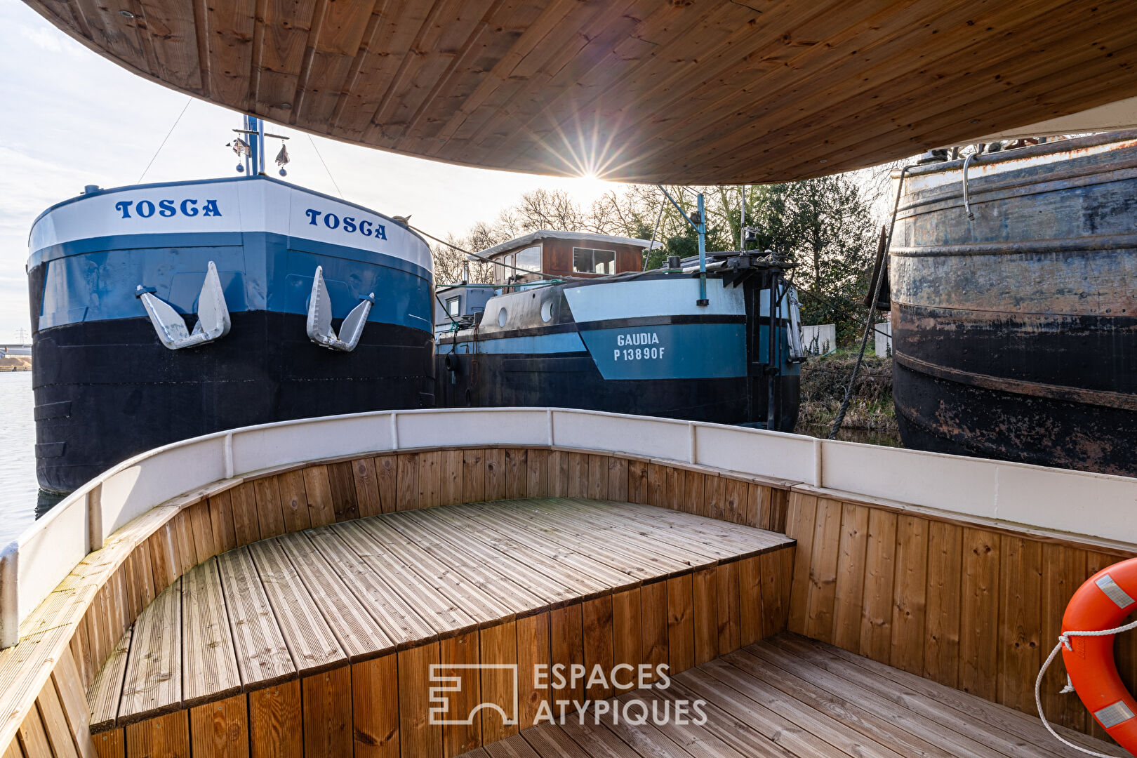Renovated barge with two terraces on the water