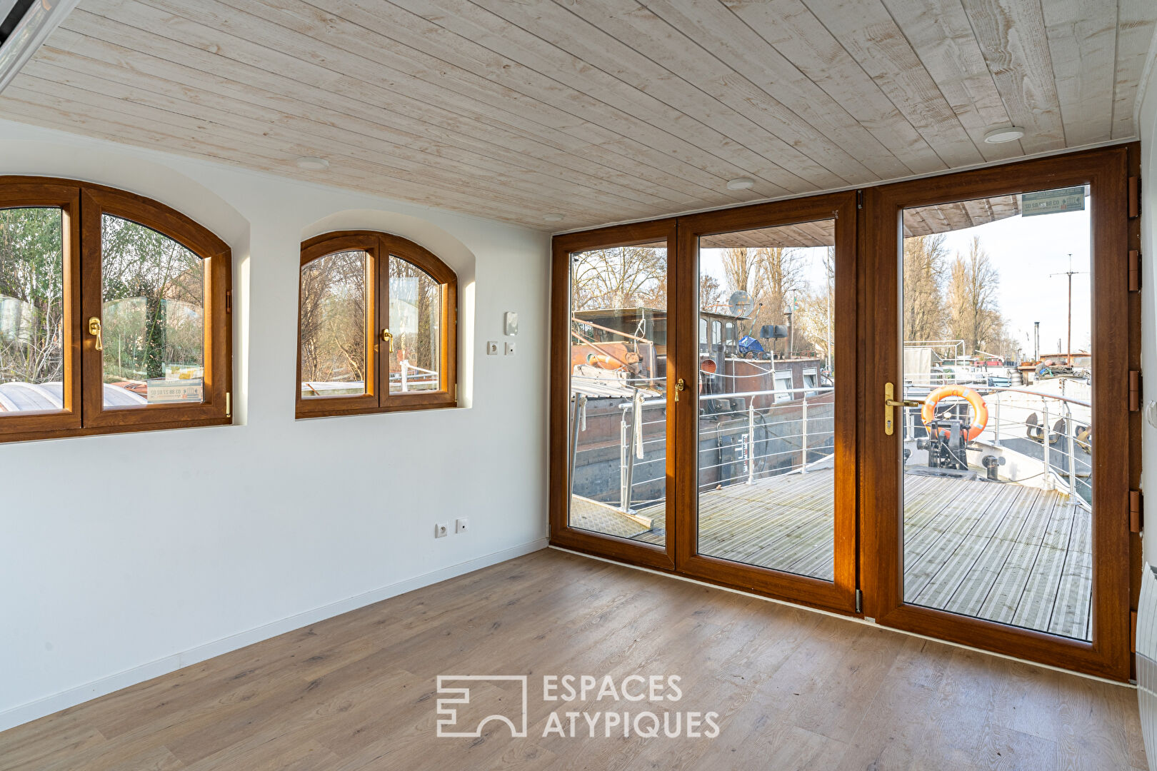 Renovated barge with two terraces on the water