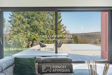 Maison bioclimatique aux lignes épurées avec vue sur la nature