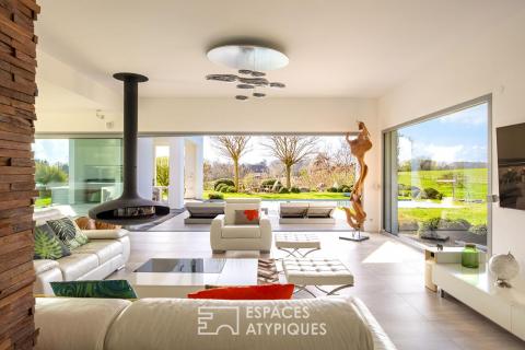 A contemporary home nestled in a secluded green setting