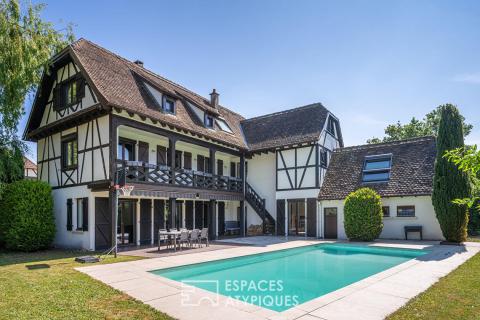 Charming home with a pool and tree-lined garden