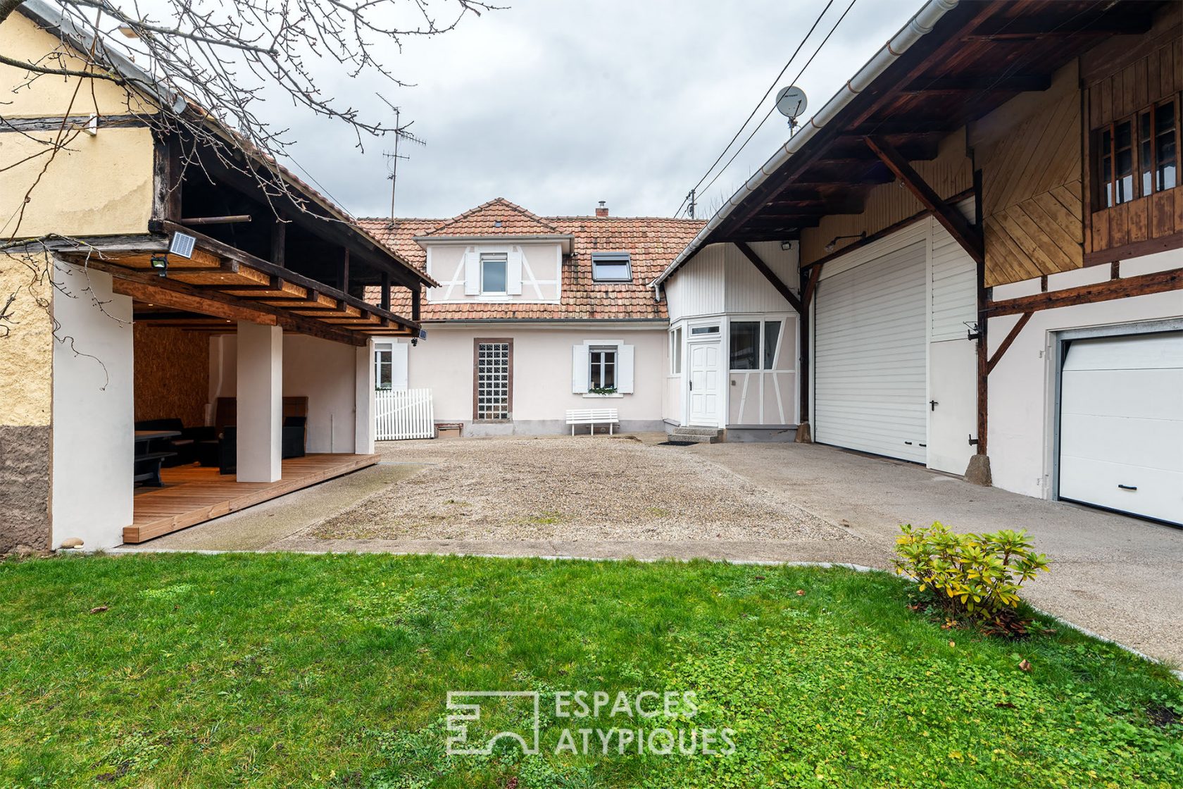 Old renovated farmhouse and its outbuildings