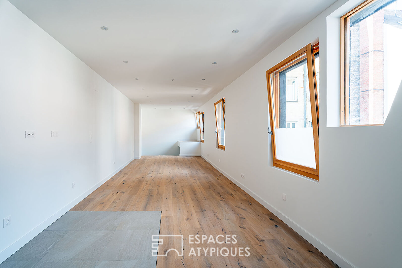 Renovated duplex nestled under the roofs