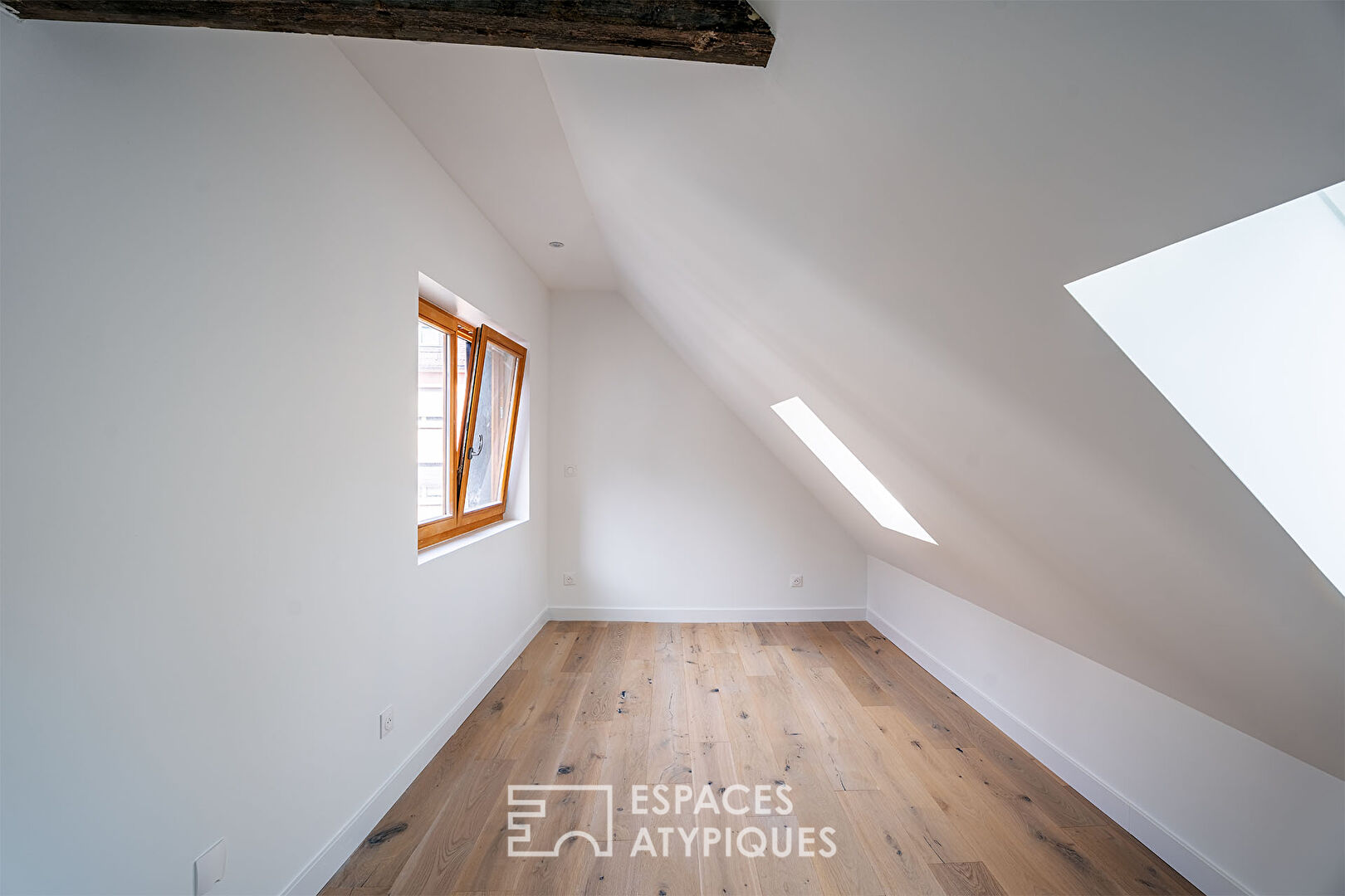 Renovated duplex nestled under the roofs