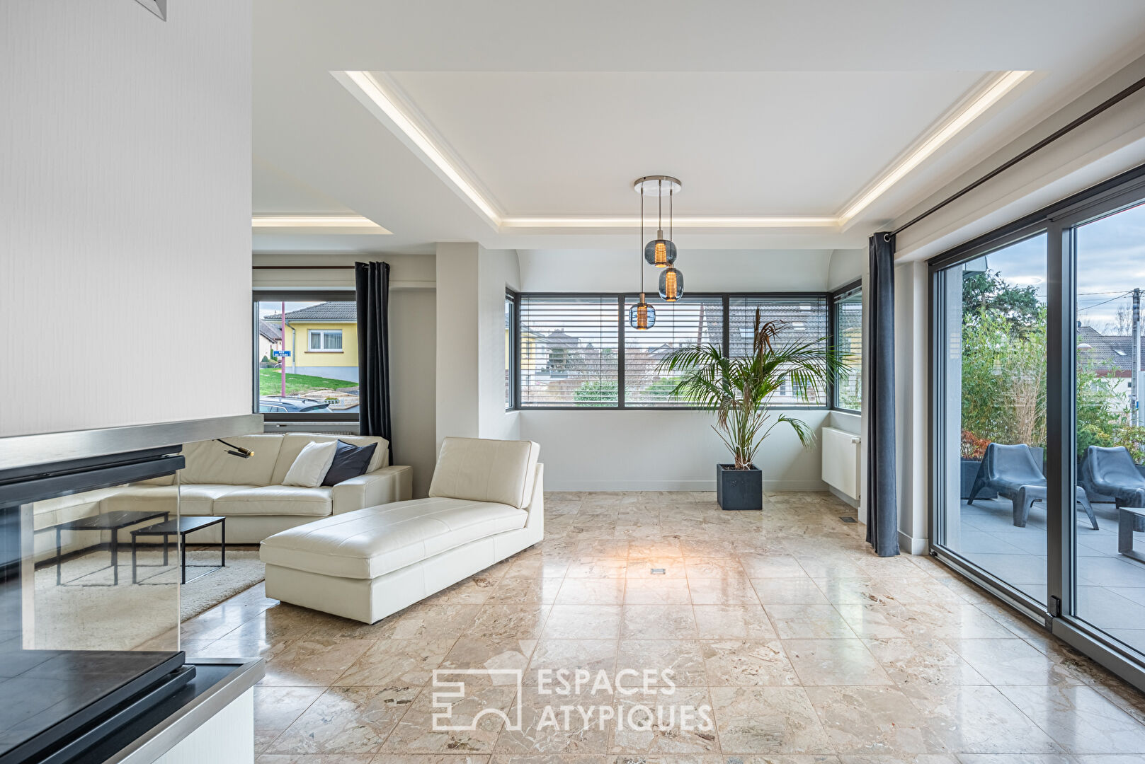 Renovated house from the 70’s and its garden with trees