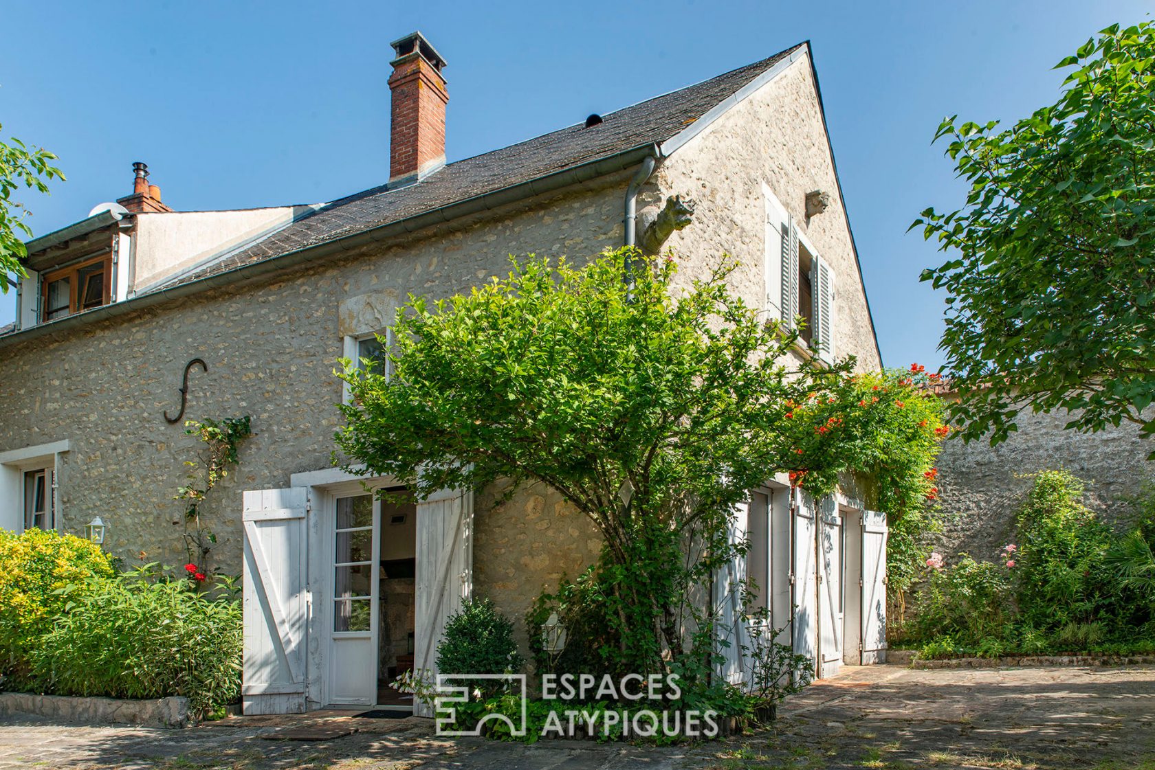 Old sheepfold and farmhouse with tree-lined courtyard