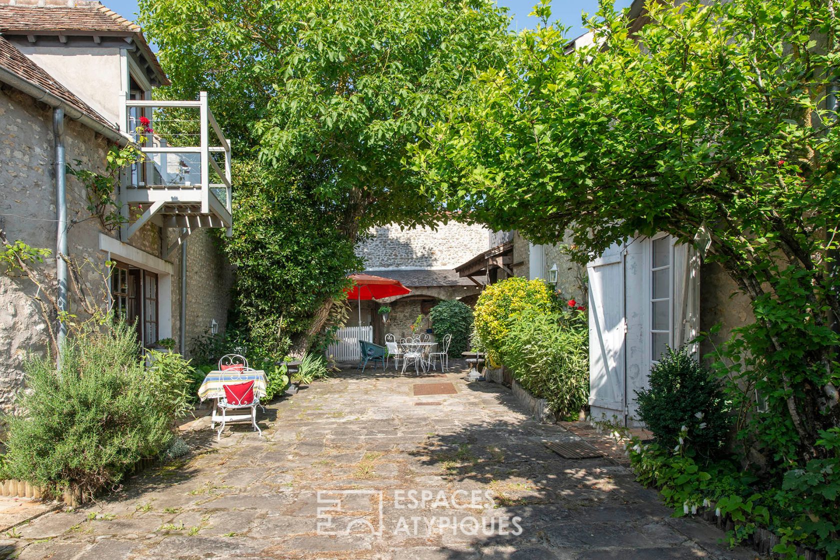 Old sheepfold and farmhouse with tree-lined courtyard