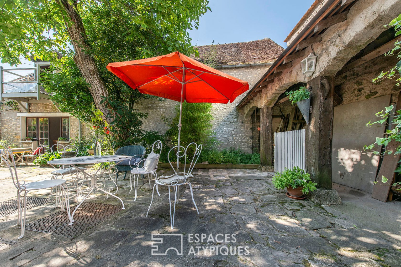 Old sheepfold and farmhouse with tree-lined courtyard