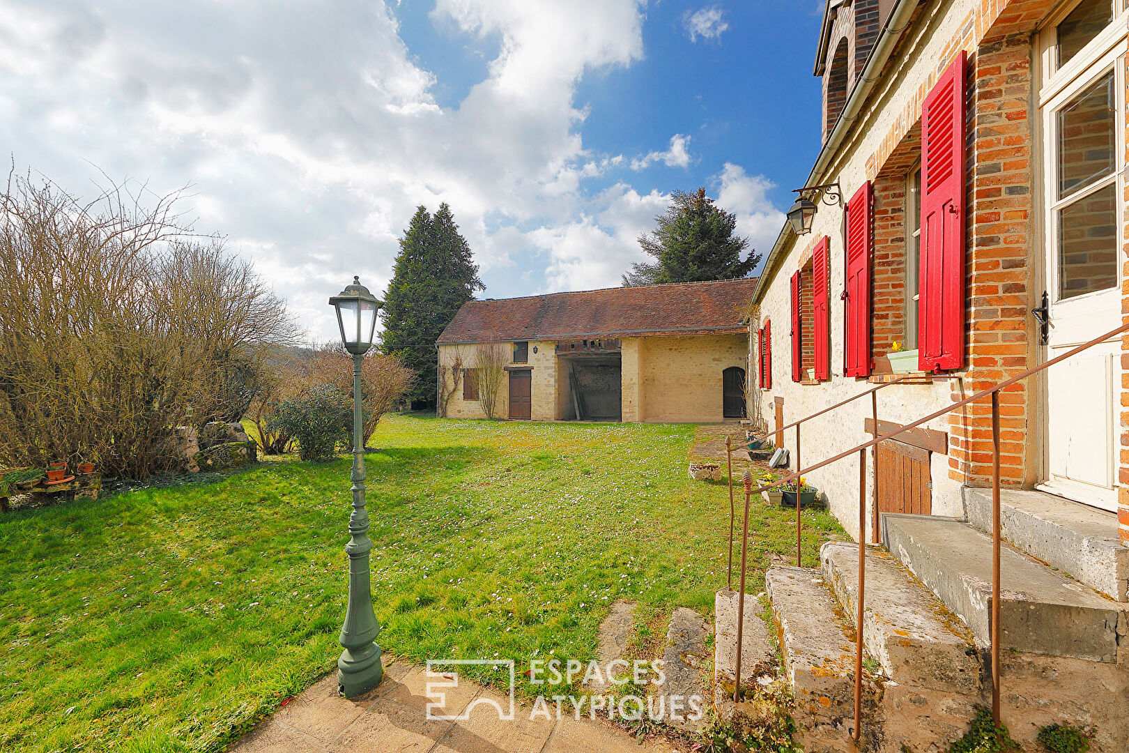 Old farmhouse with outbuildings and garden