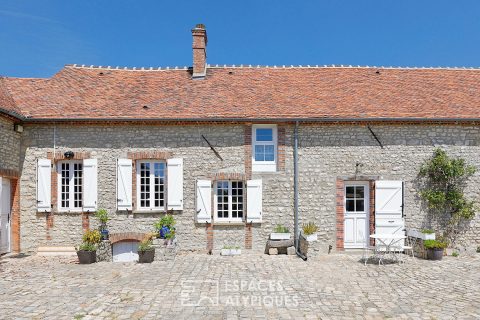 Corps de ferme réinventé avec jardin