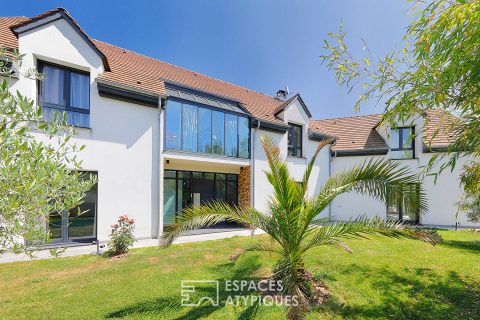 Architect-designed house with swimming pool and landscaped garden