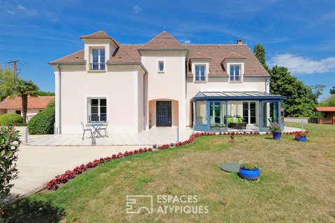 Maison contemporaine et familiale avec jardin paysager