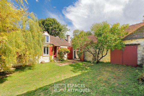 Maison de plain-pied en pierre avec jardin arboré
