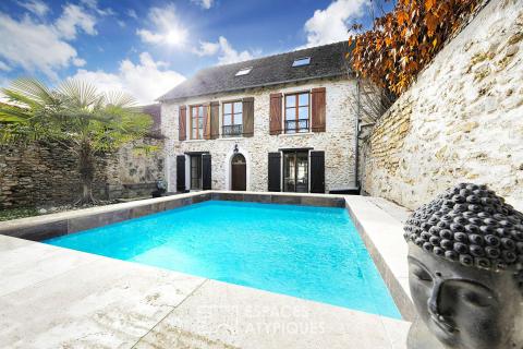 Former presbytery in the heart of the village with garden, swimming pool and outbuilding
