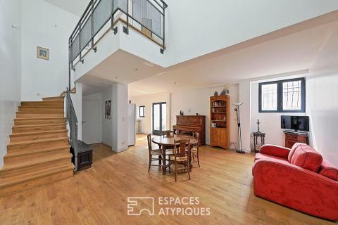 Esprit factory et volumes spectaculaires pour ce loft avec jardin privatif