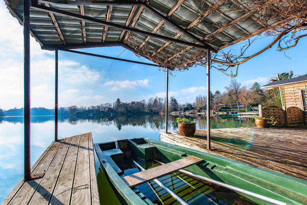 Wood frame house with stunning views of a lake
