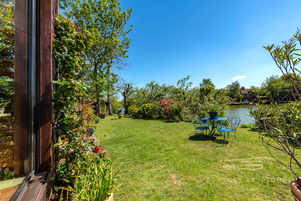 Two houses with stunning views of a lake