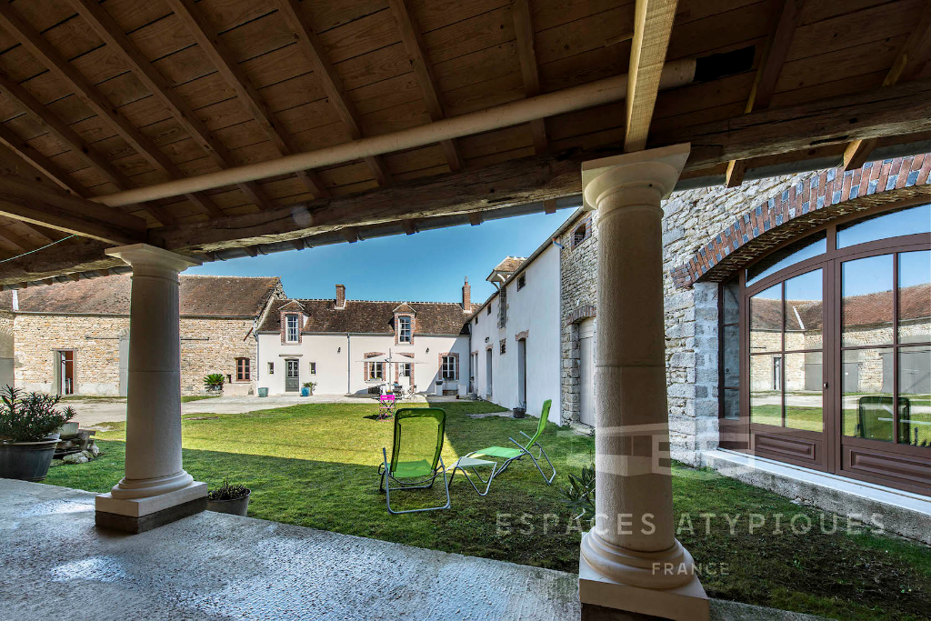 Farmhouse renovated country style “chic” with outbuildings.