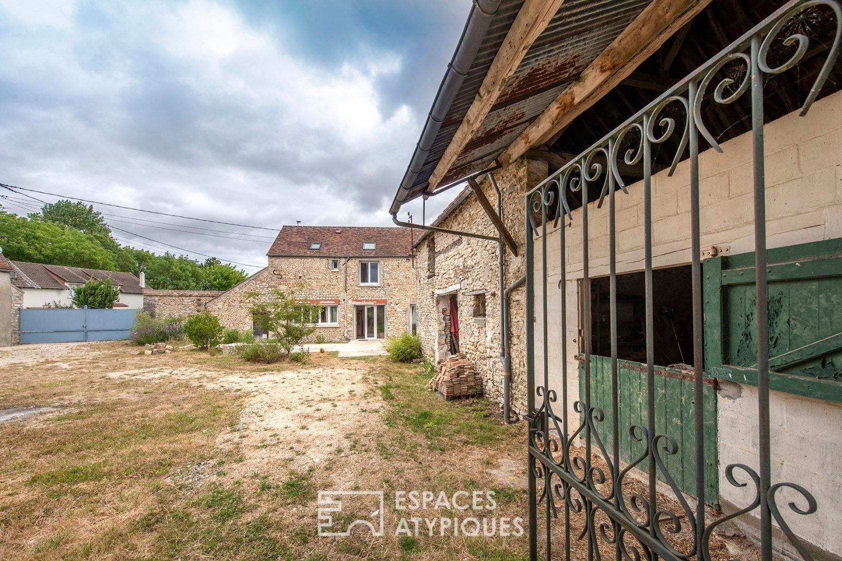 Farm building with outbuildings and mature garden