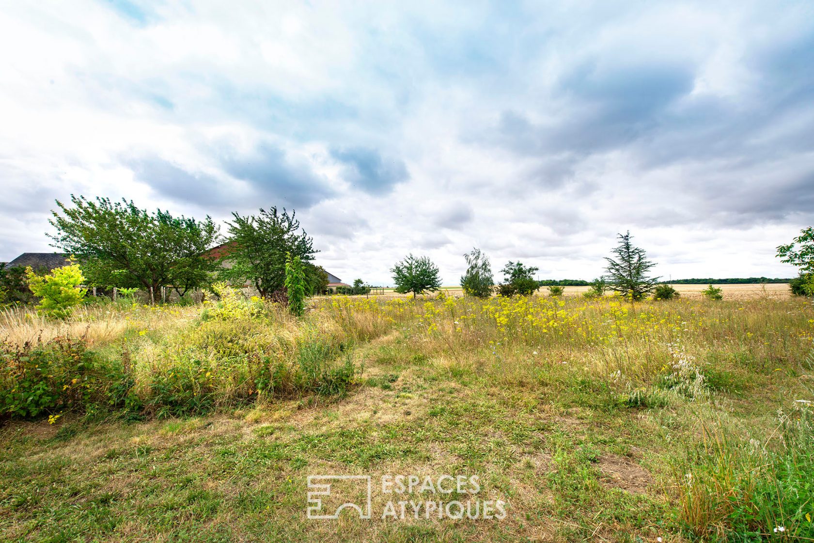 Farm building with outbuildings and mature garden
