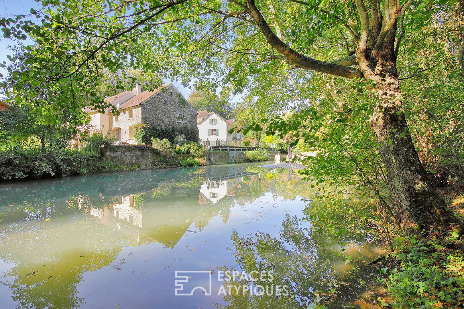 Old mill with outbuildings and its park