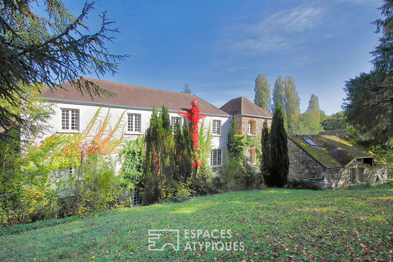 Old mill with outbuildings and its park