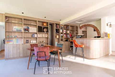 An old mill elegantly renovated between sky and river