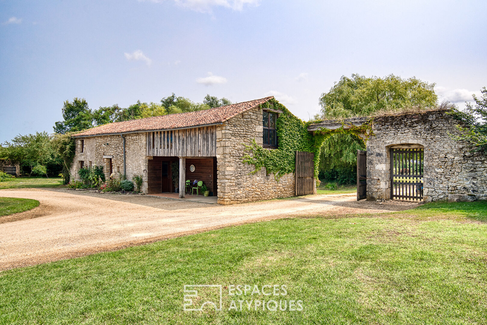 15th-century Seigneurie and its outbuildings in a verdant setting