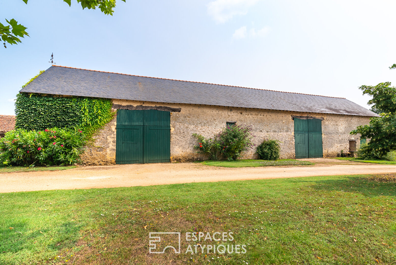 15th-century Seigneurie and its outbuildings in a verdant setting