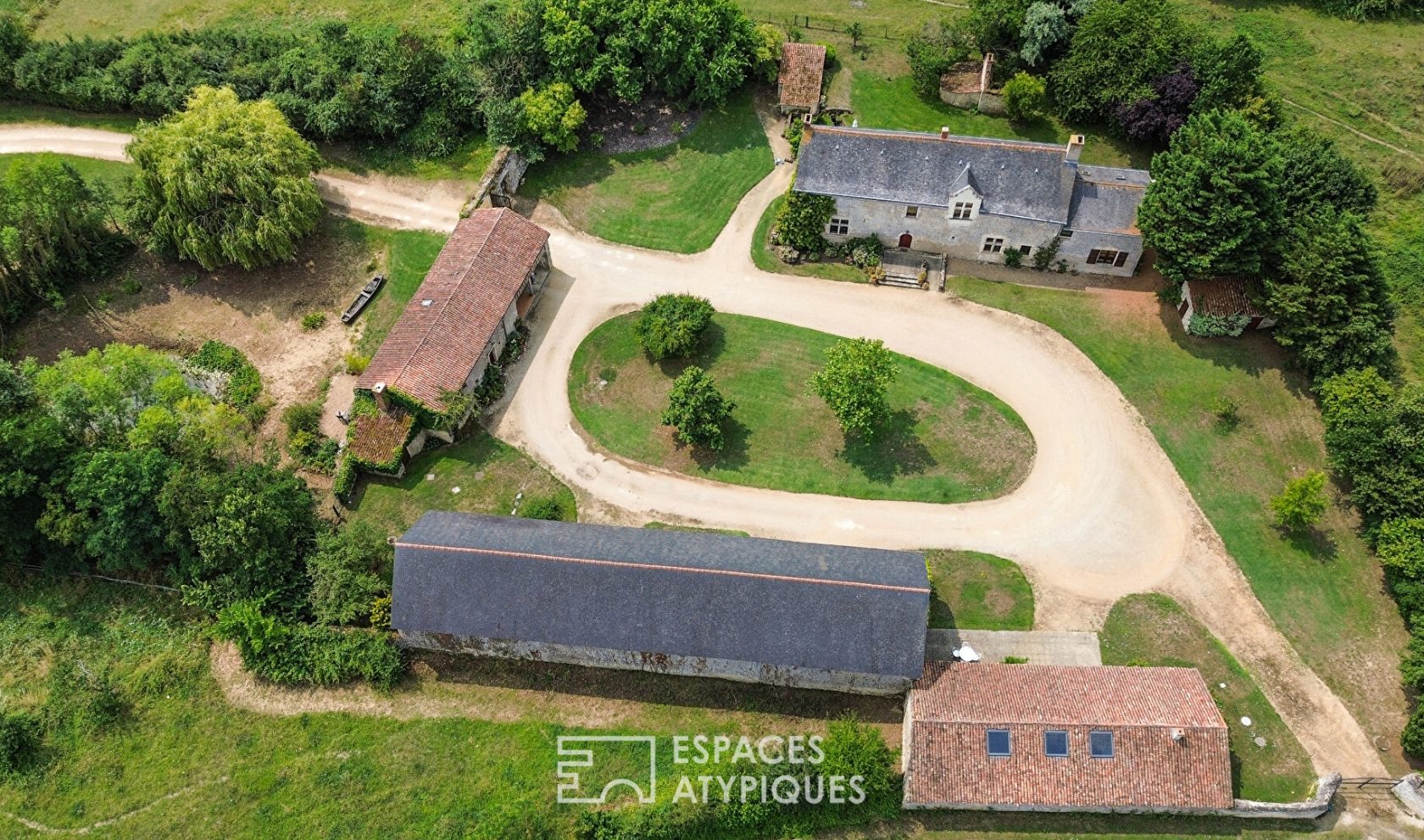 15th-century Seigneurie and its outbuildings in a verdant setting