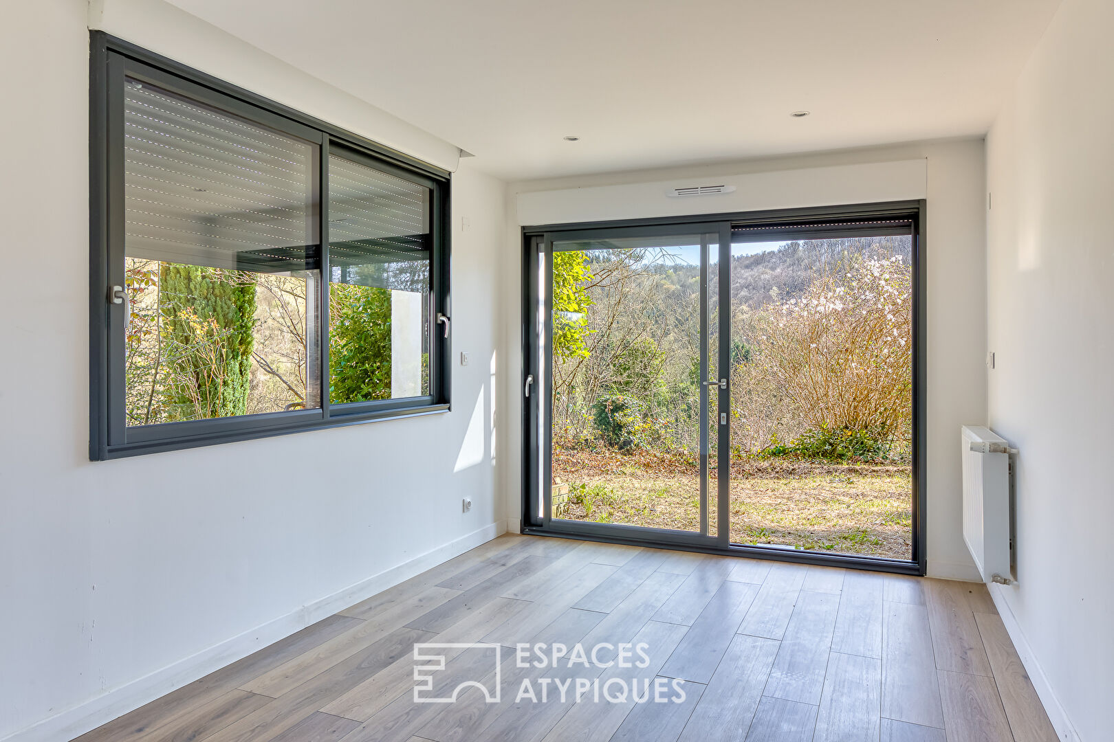 House in a green setting with panoramic view