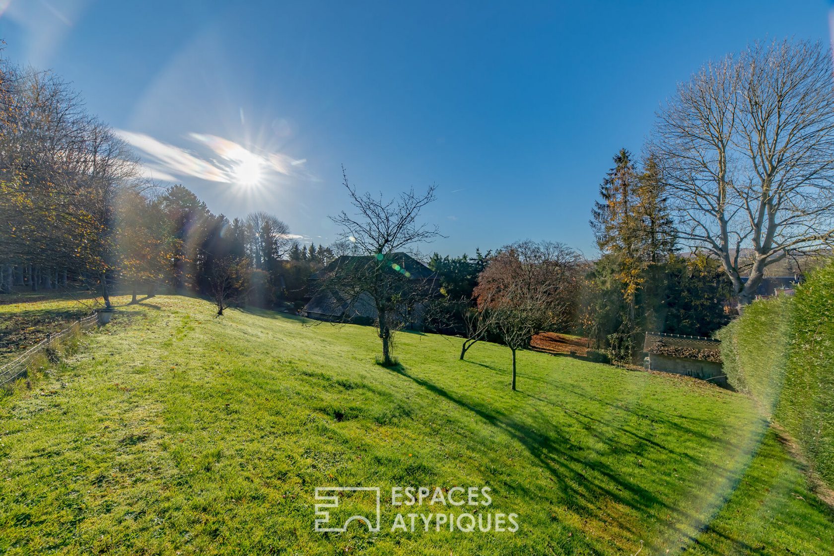 Anglo-Norman property and its landscaped park with swimming pool