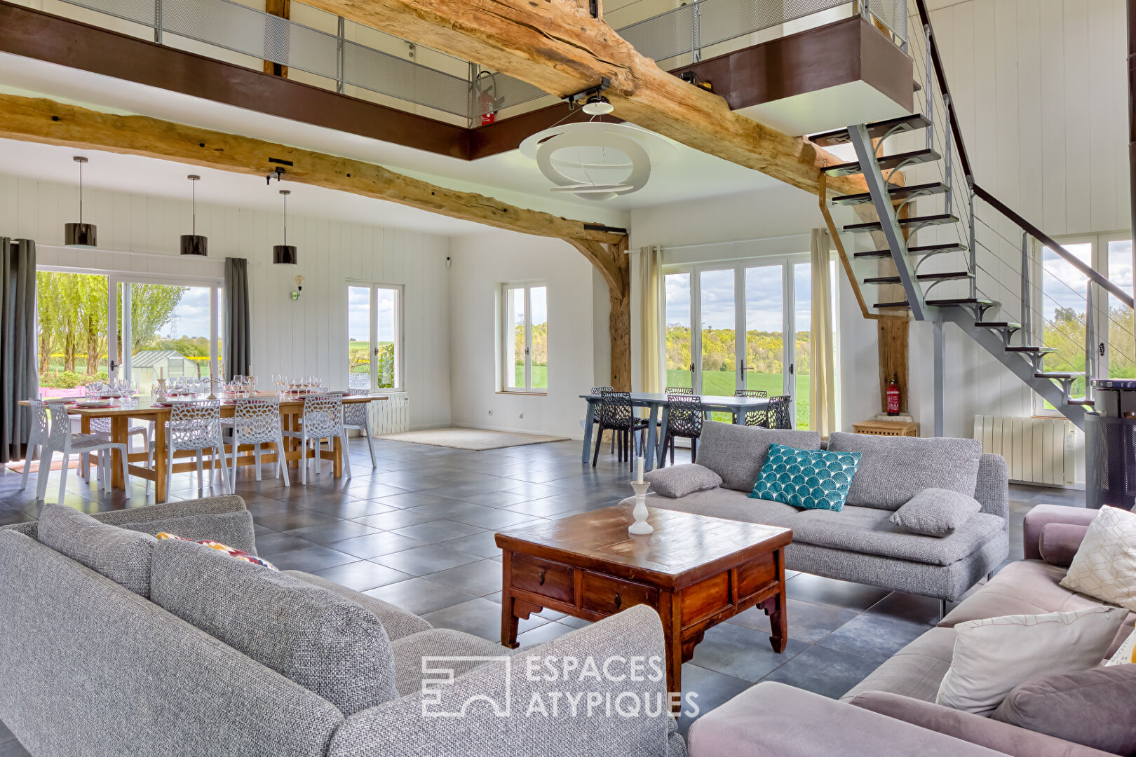 Renovated old riding school, combining Norman charm and spectacular volumes