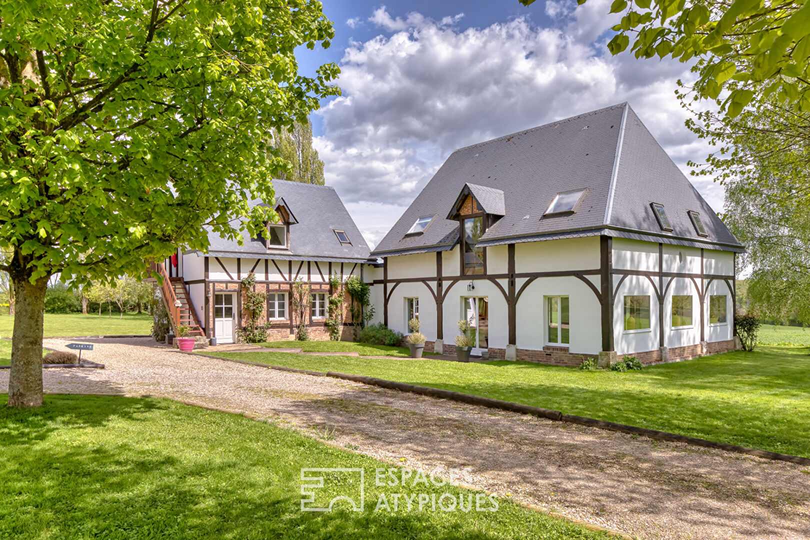 Renovated old riding school, combining Norman charm and spectacular volumes