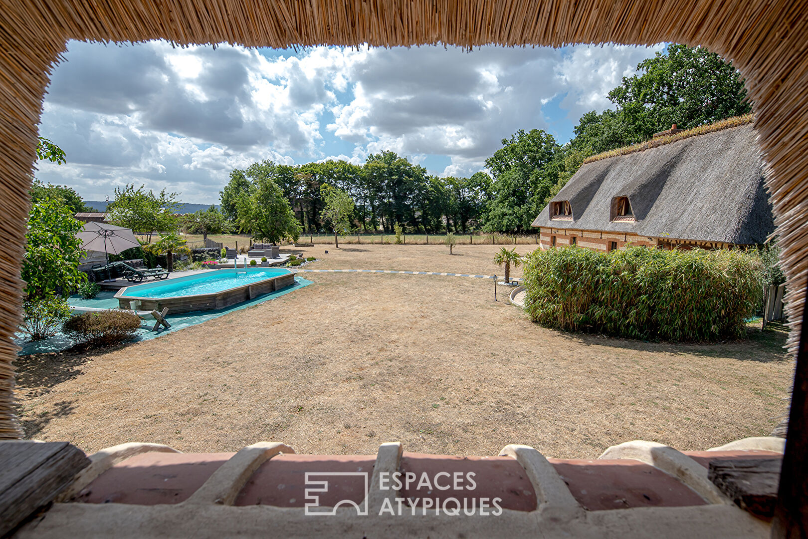 Thatched cottage from an old barn with swimming pool and outbuilding