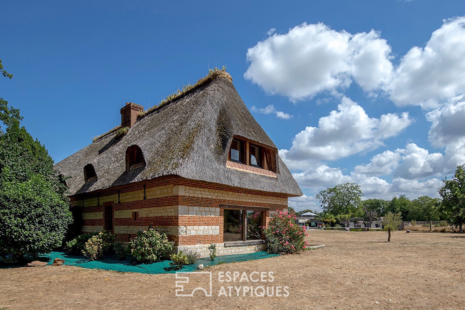Thatched cottage from an old barn with swimming pool and outbuilding
