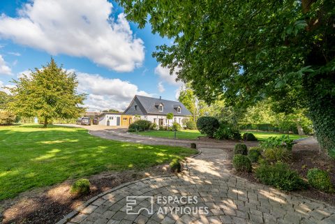 Restructured country house with terraces and landscaped garden