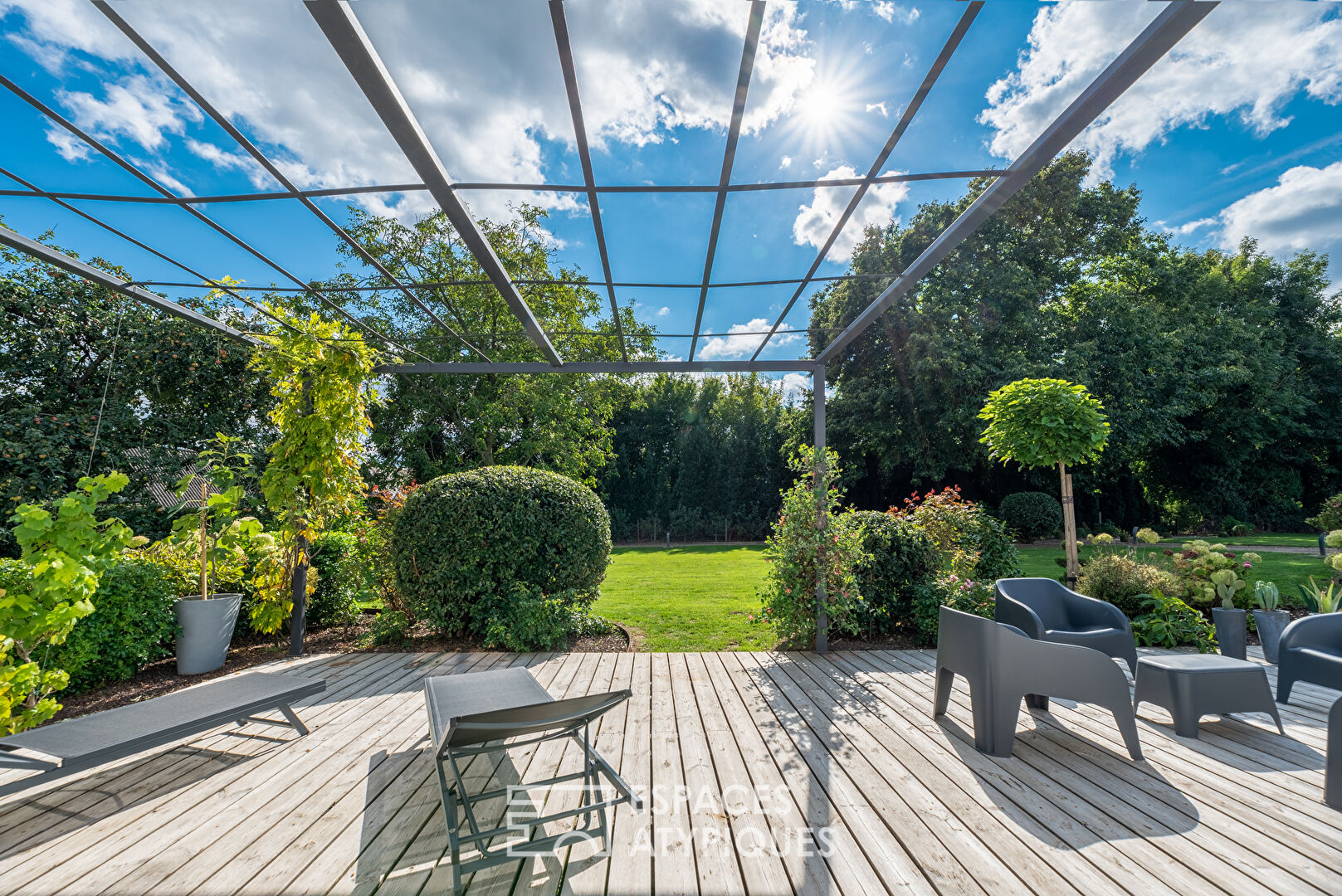 Restructured country house with terraces and landscaped garden