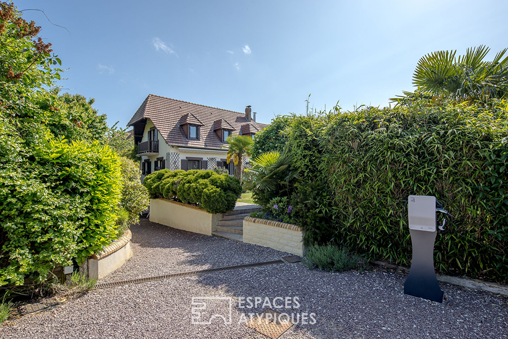 Family house with covered swimming pool and landscaped garden