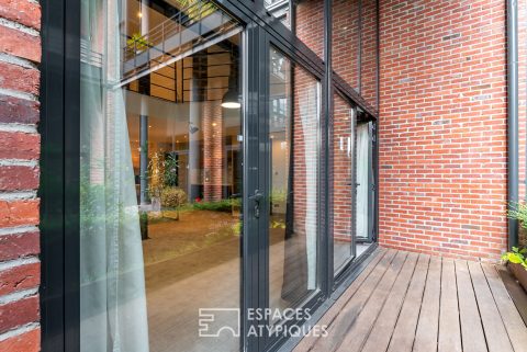 Loft with terrace in a former cotton mill