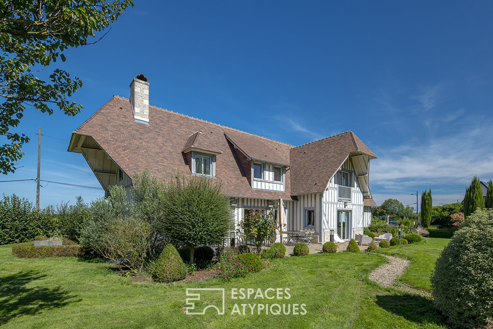 Beautiful contemporary Normandy on landscaped grounds