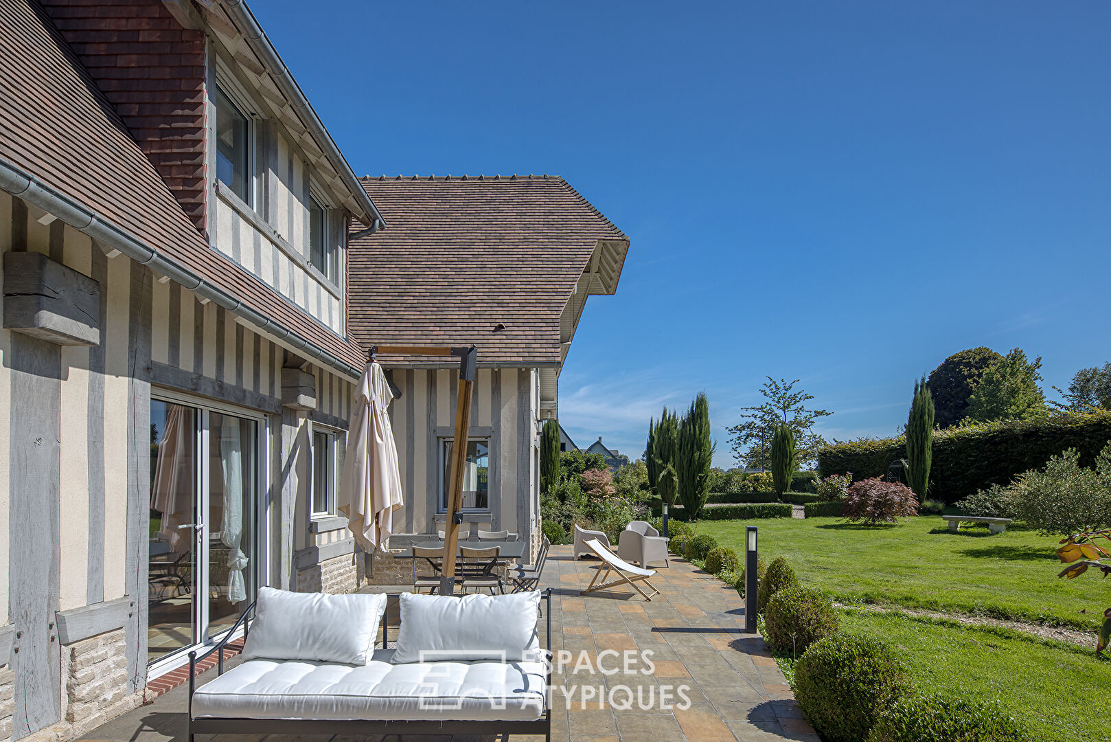 Beautiful contemporary Normandy on landscaped grounds