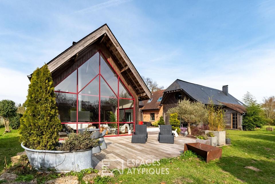 Ancienne grange revisitée par un architecte avec extension contemporaine