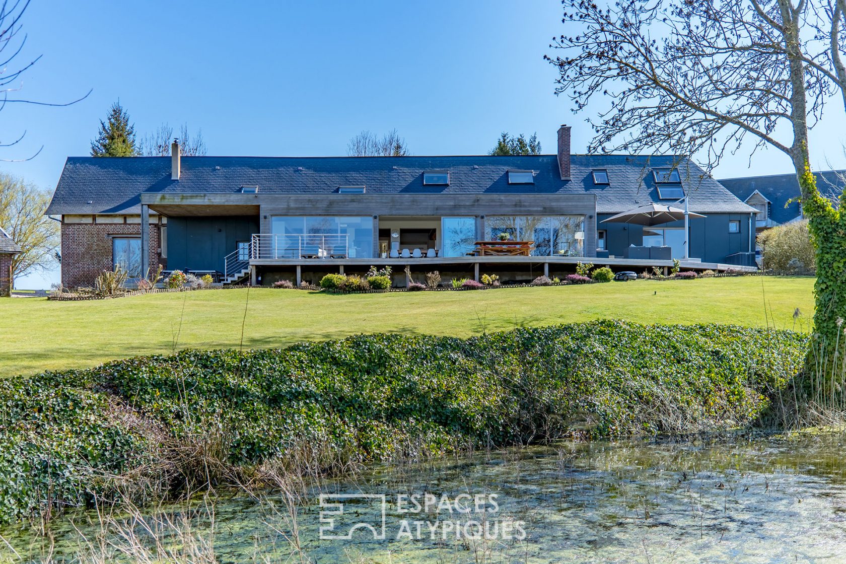 Revisited farmhouse with architect’s extension and view of the Normandy countryside