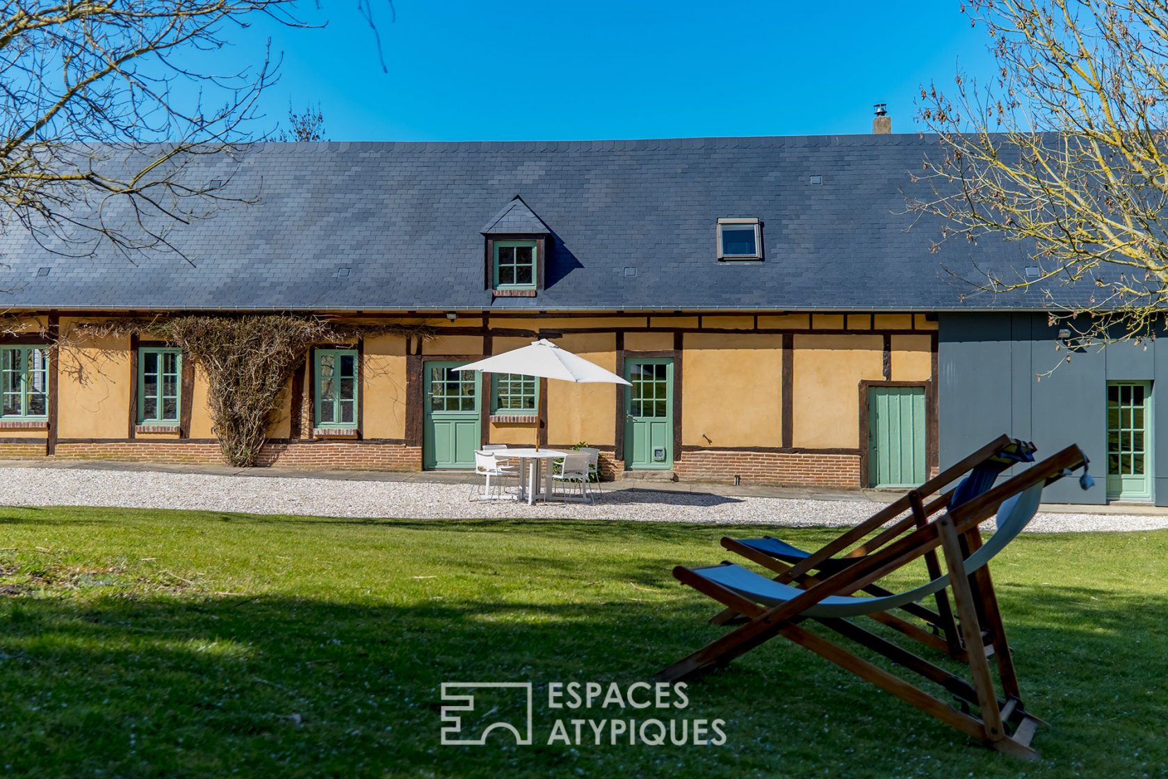 Revisited farmhouse with architect’s extension and view of the Normandy countryside