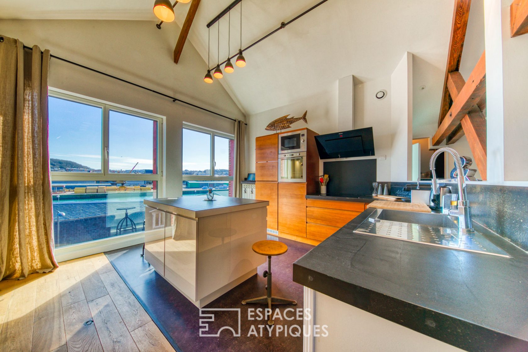 Contemporary loft under the eaves of an old port building