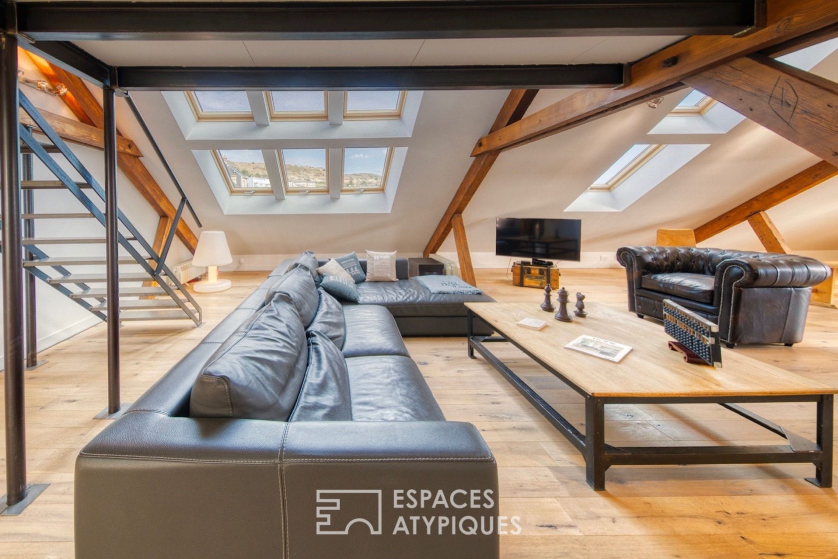 Contemporary loft under the eaves of an old port building