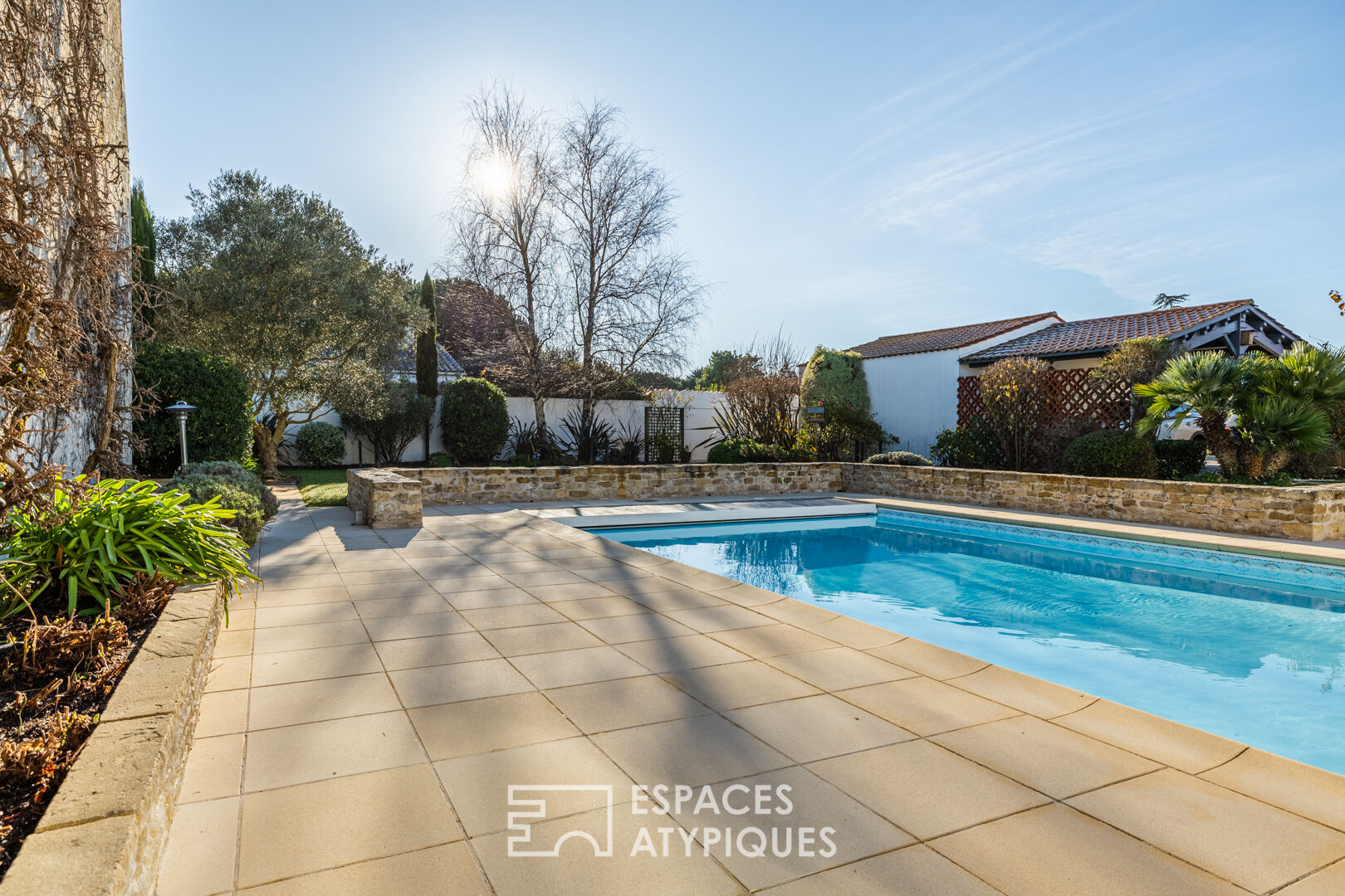 A bright, hidden hideaway in the heart of the city with a tree-filled garden and swimming pool